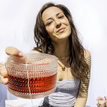 Load image into Gallery viewer, Jess holding out a cup of tea